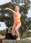 RSG-680 Crystal Pirouette sleeveless leotard. RS Gymwear Australia. Dancer in orange leotard. 